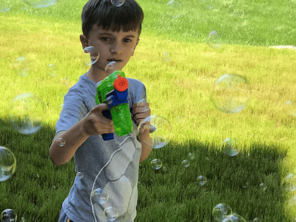 kids playing with bubbles to stay busy