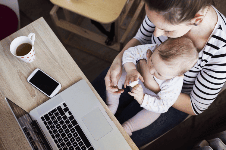mom and baby working at computer